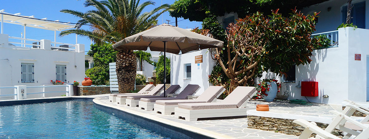 Pool and sunbeds at Petali Village Hotel in Sifnos